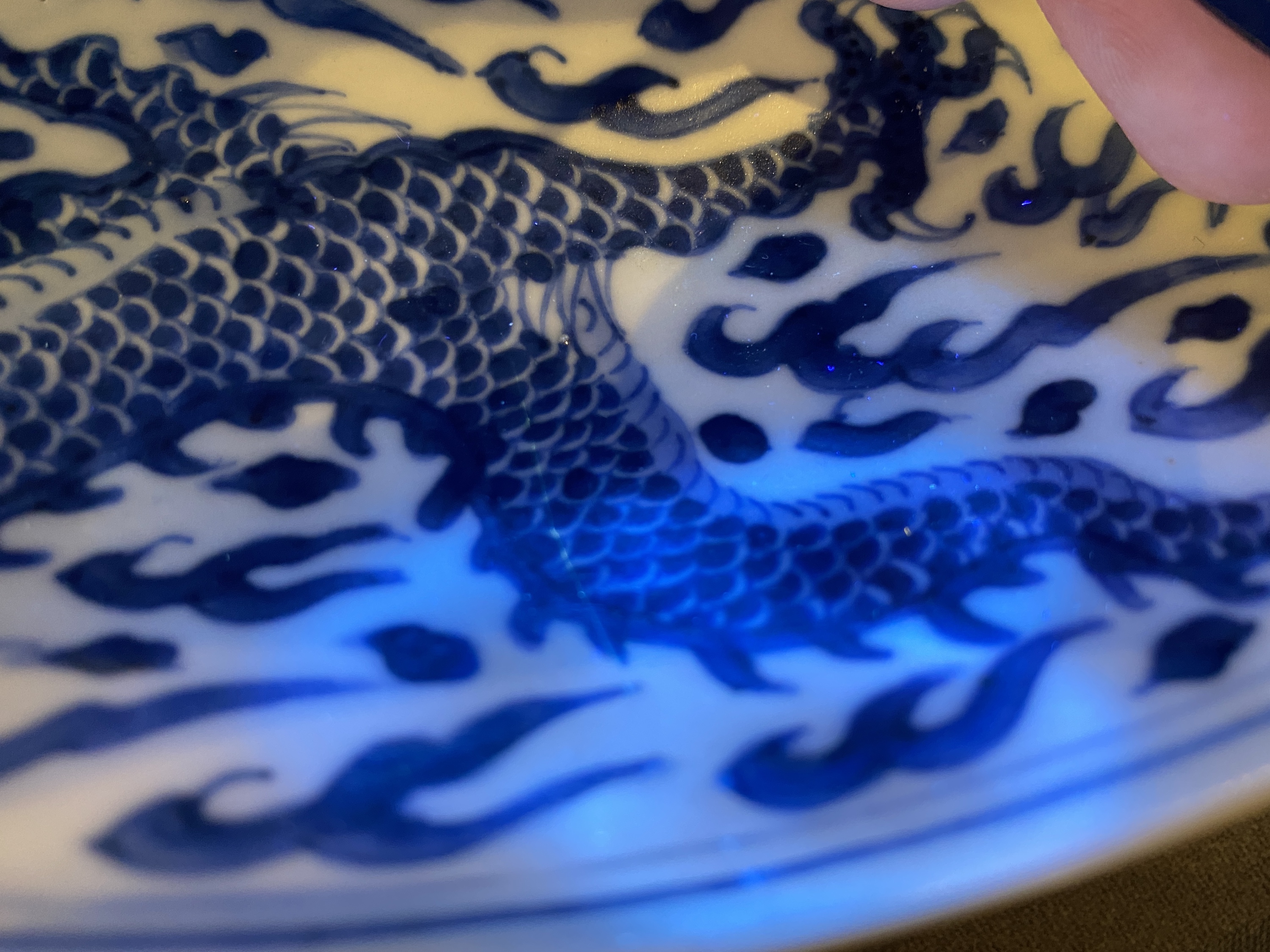 A Chinese blue and white 'dragon' dish, Kangxi mark and of the period - Image 15 of 18