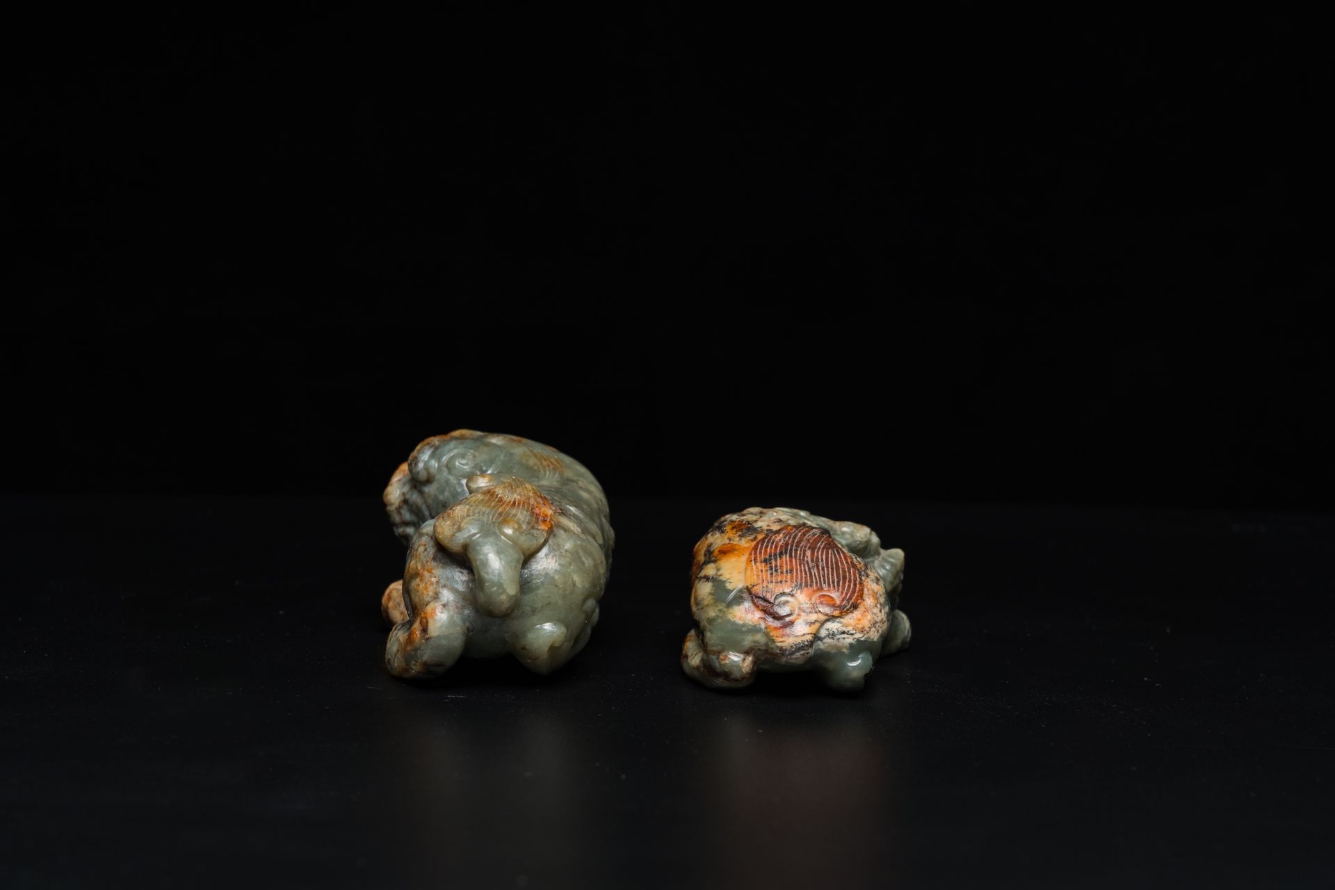 Two Chinese celadon and russet jade Buddhist lion sculptures, Qing - Image 5 of 21