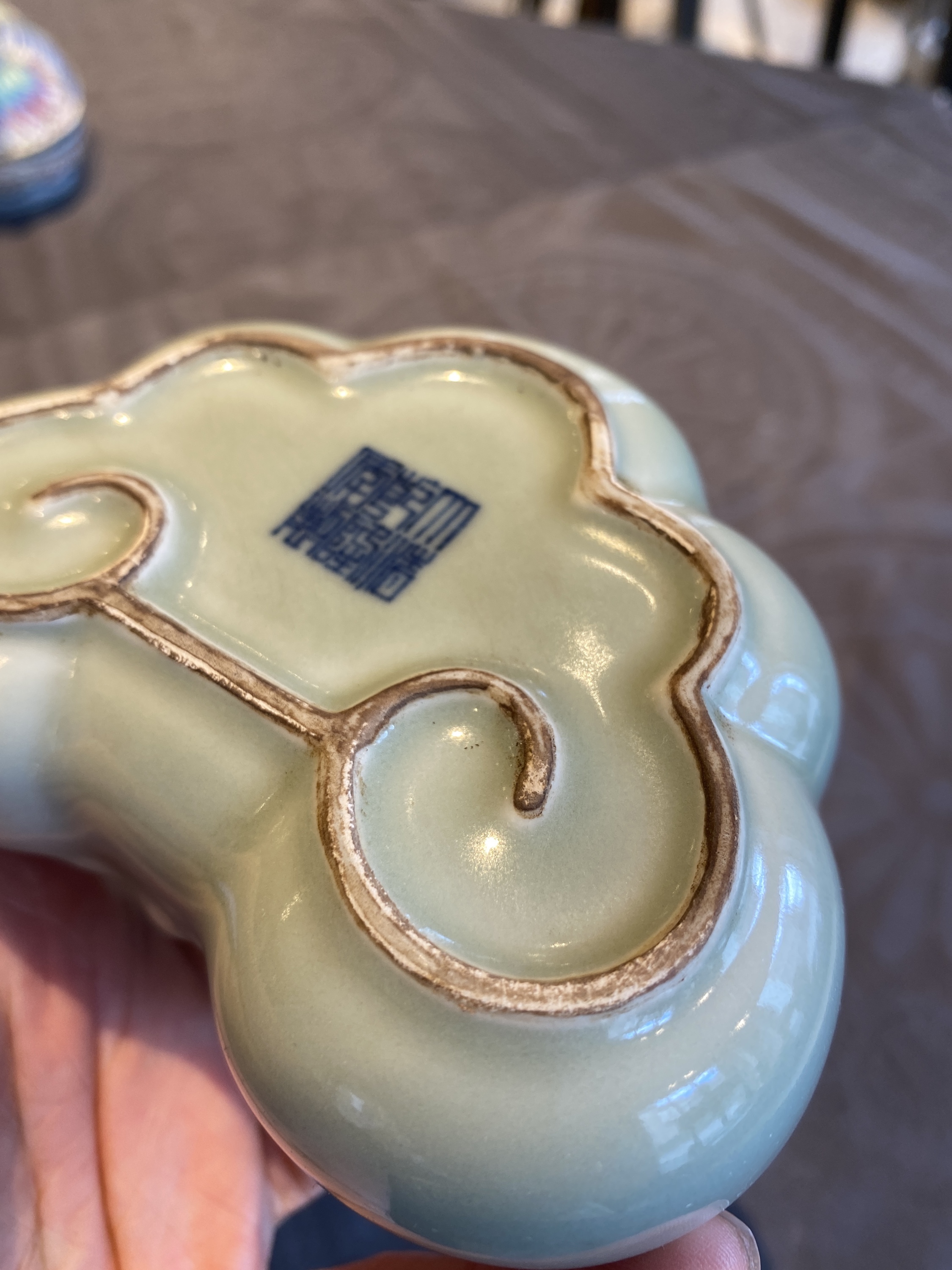 A Chinese celadon-glazed 'lingzhi' brush washer, Qianlong mark, 19/20th C. - Image 15 of 15