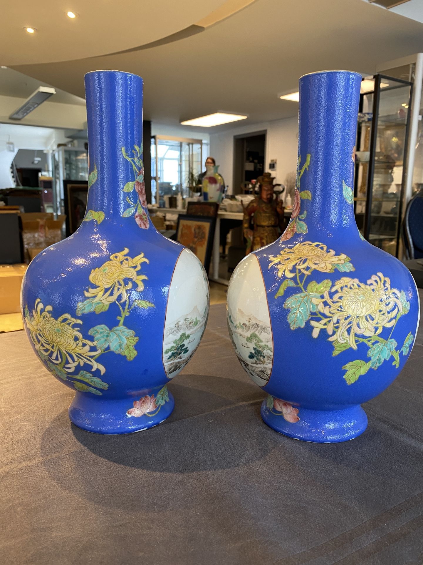 A pair of Chinese blue-ground famille rose vases, He Xuren ___ seal mark, 20th C. - Image 7 of 28