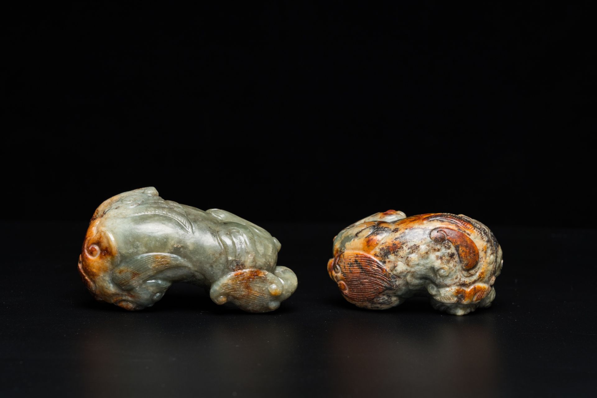 Two Chinese celadon and russet jade Buddhist lion sculptures, Qing - Image 6 of 21