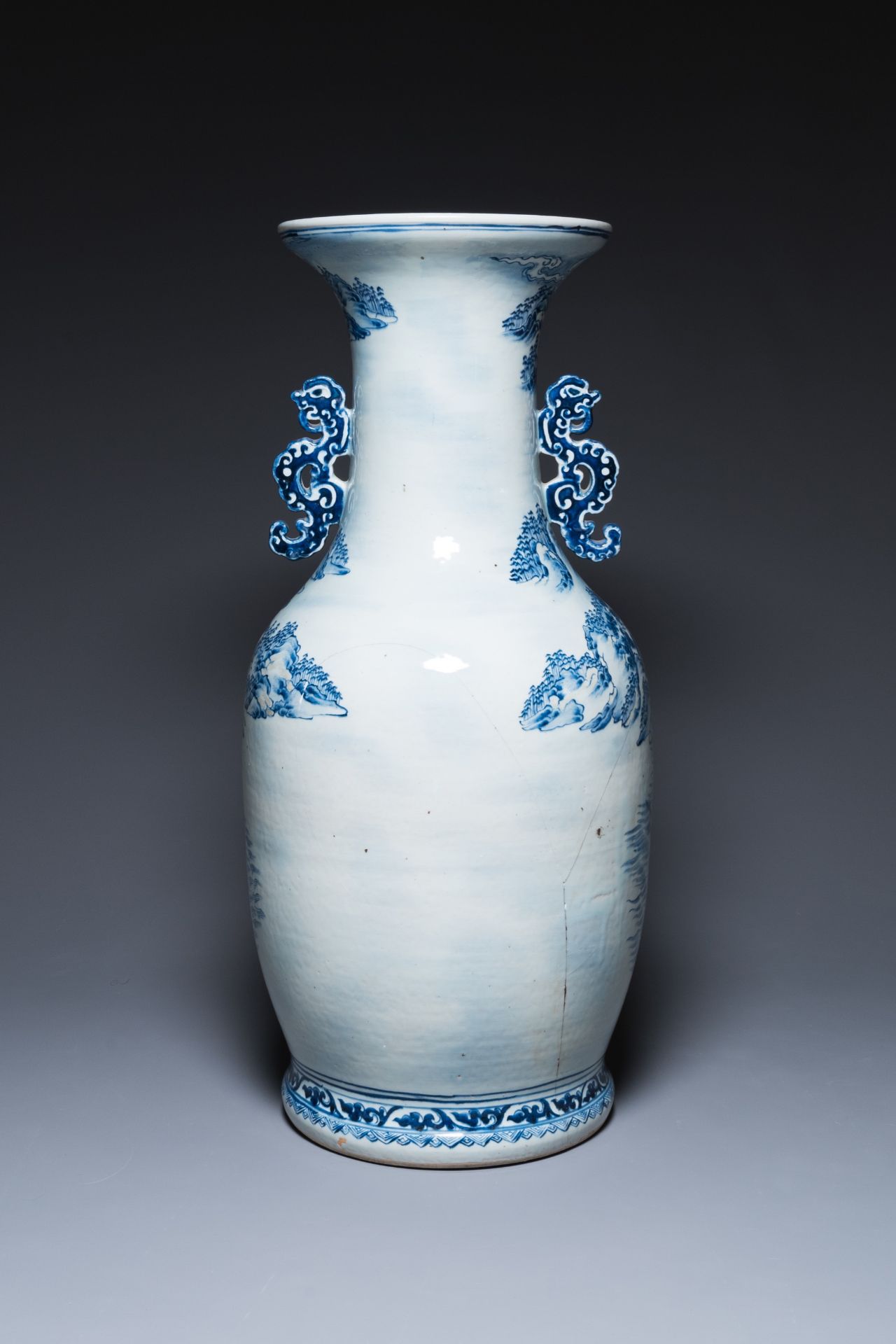 A large Chinese blue, white and copper-red vase with a mountainous river landscape, 19th C. - Image 3 of 6