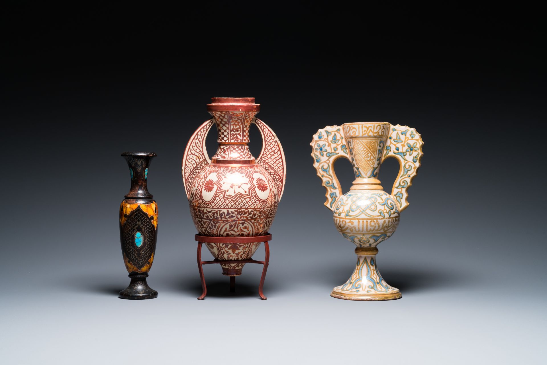 Two Hispano-Moresque lustre-glazed 'Alhambra' vases and a stone-inlaid wooden vase, Spain and Northe
