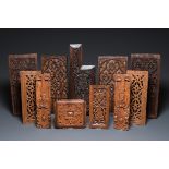 A collection of 11 carved wooden panels with various designs, France, Holland and/or Flanders, 14/16