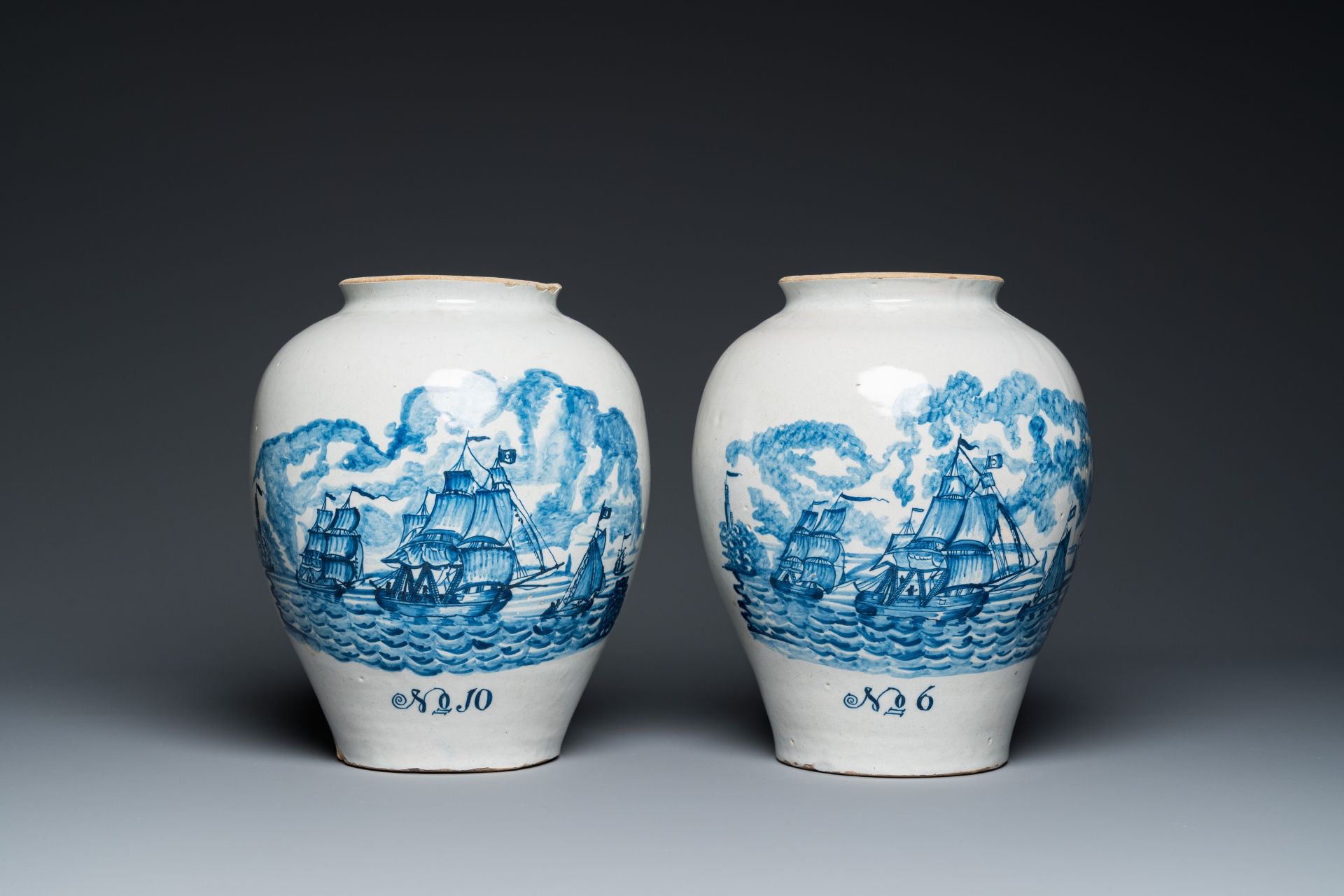 A pair of rare Dutch Delft blue and white 'maritime subject' tobacco jars with brass covers, 18th C. - Image 2 of 7