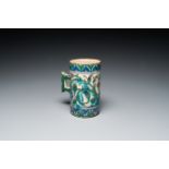 A polychrome Iznik-style mug, Kutahya, Turkey, 19th C.