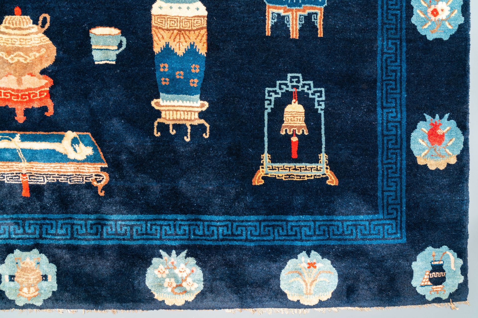 A large Chinese blue-ground 'antiquities' rug, 19th C. - Image 5 of 6