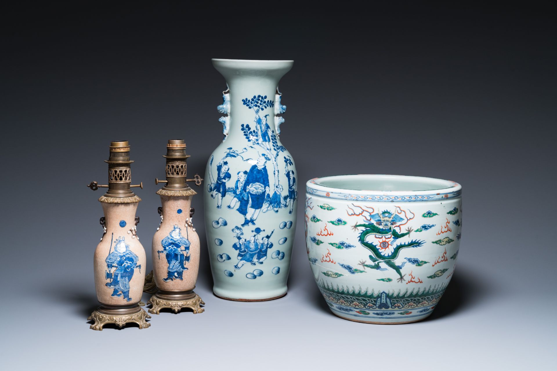 A Chinese blue and white celadon-ground vase, a pair of Nanking vases and a famille verte fish bowl,