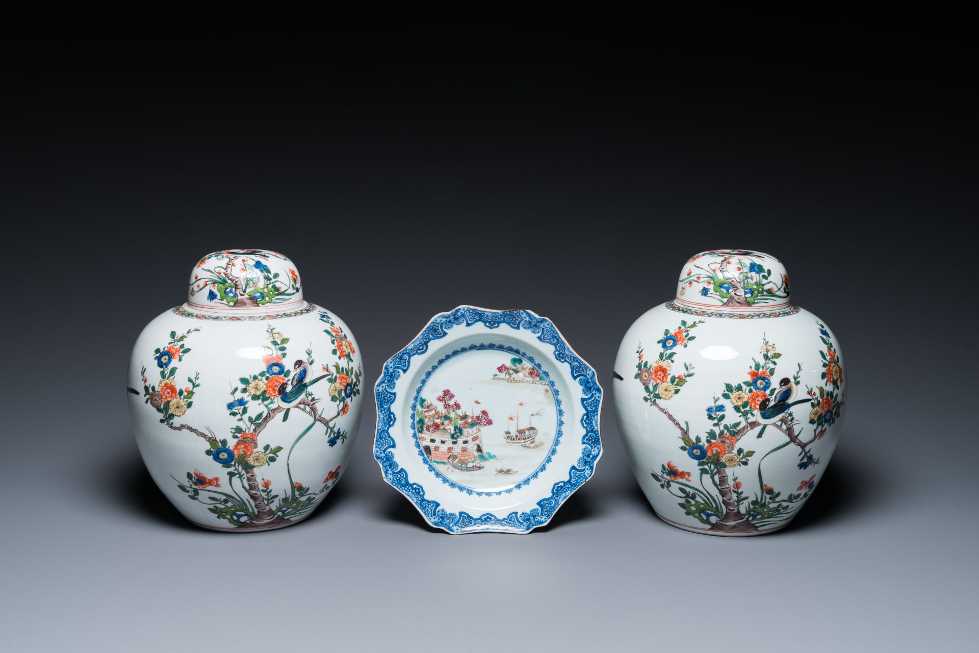 A Chinese famille rose 'Fort Folly' plate and a pair of Samson famille verte-style jars and covers,