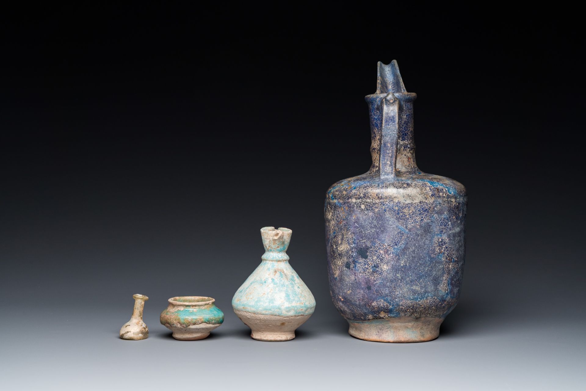 Three blue- and turquoise-glazed Islamic pottery wares and a glass bottle, Kashan and Raqqa, 12th C. - Image 3 of 7