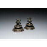 A pair of Italian engraved bronze candlesticks, probably Venice, 16th C.