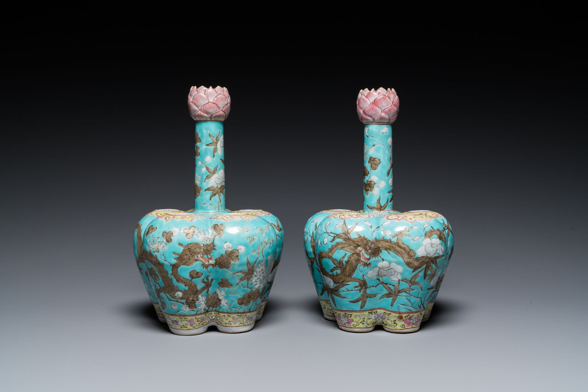 A pair of Chinese famille rose turquoise-ground flower vases with dragons, 19th C.