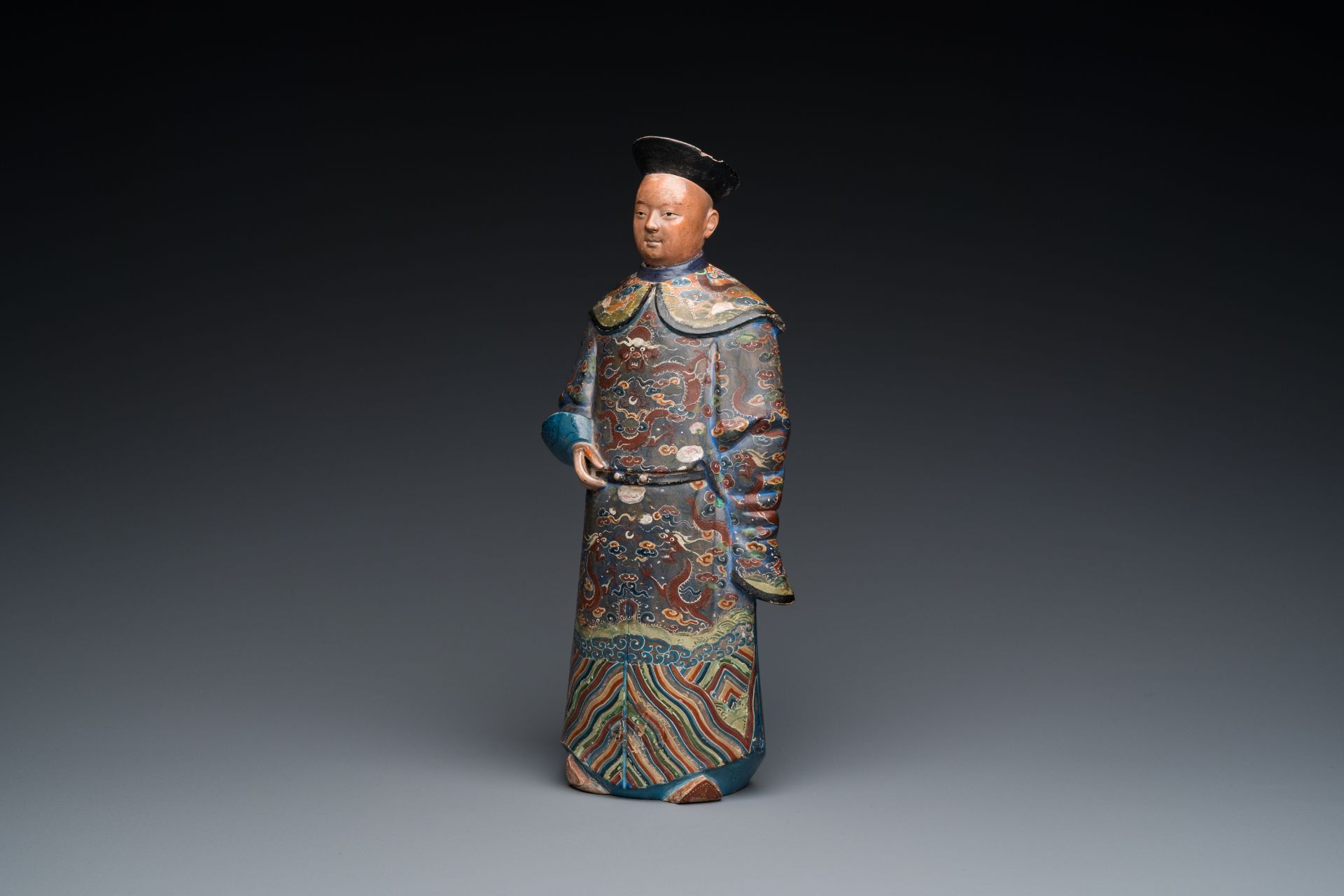 A Chinese painted terracotta figure of a mandarin, Canton, 19th C.