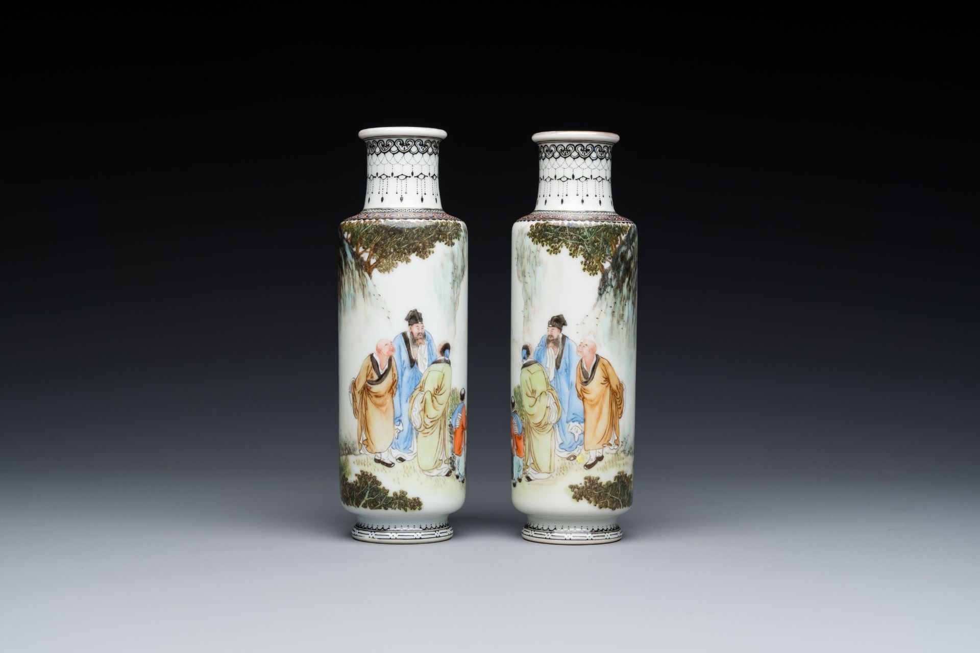 A pair of Chinese famille rose rouleau vases, signed Xiong Xiaofeng ç†Šæ›‰å³°, dated 1947