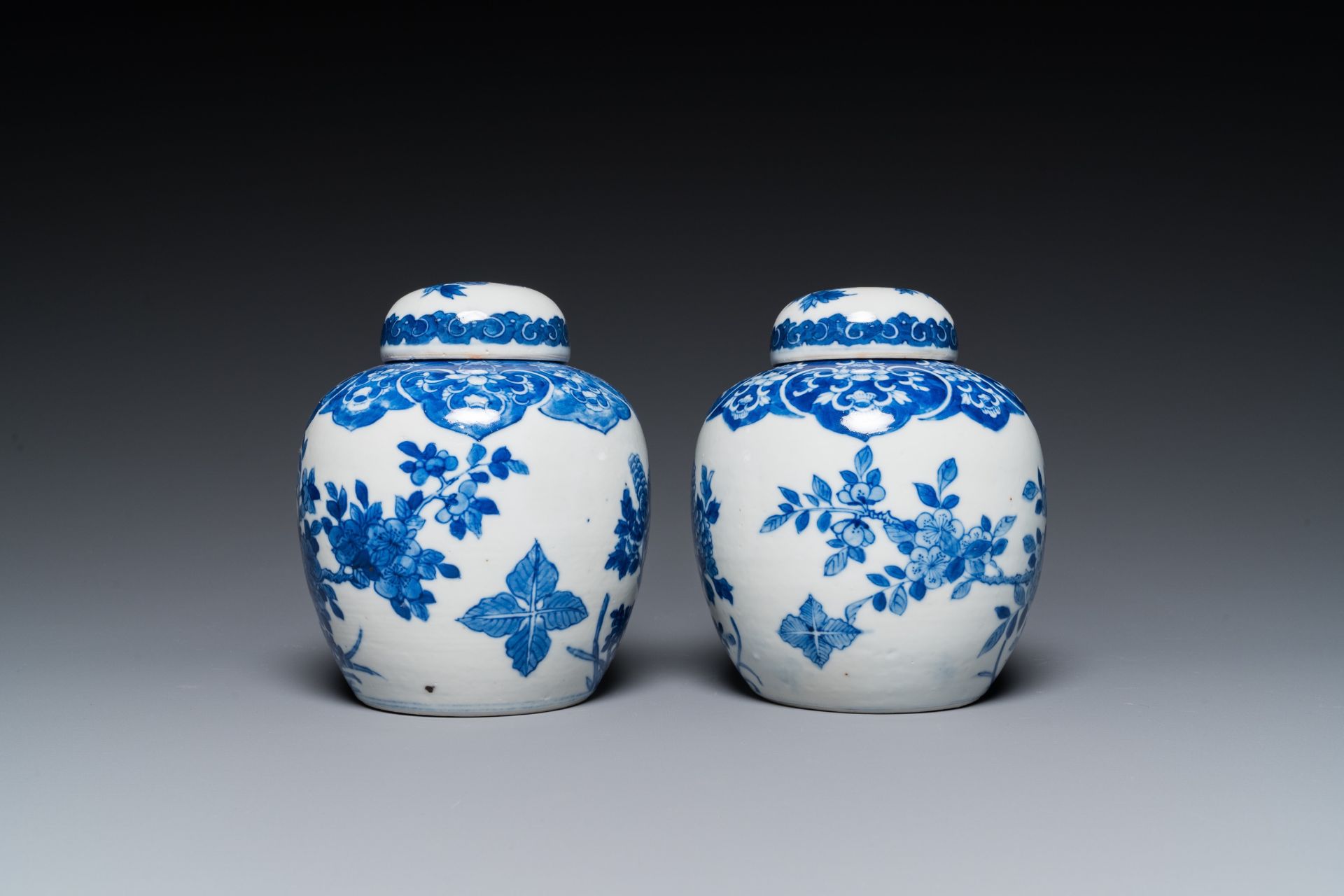 A pair of Chinese Canton famille rose vases and a pair of blue and white covered jars, 19th C. - Image 10 of 13