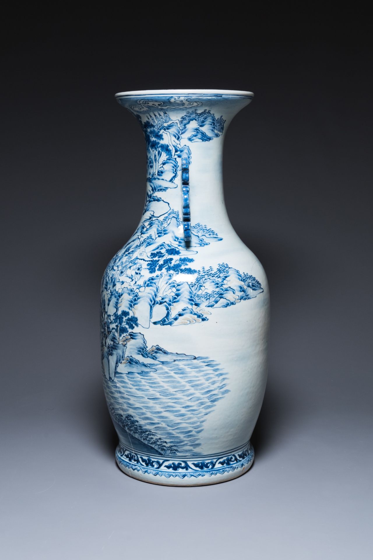 A large Chinese blue, white and copper-red vase with a mountainous river landscape, 19th C. - Image 4 of 6