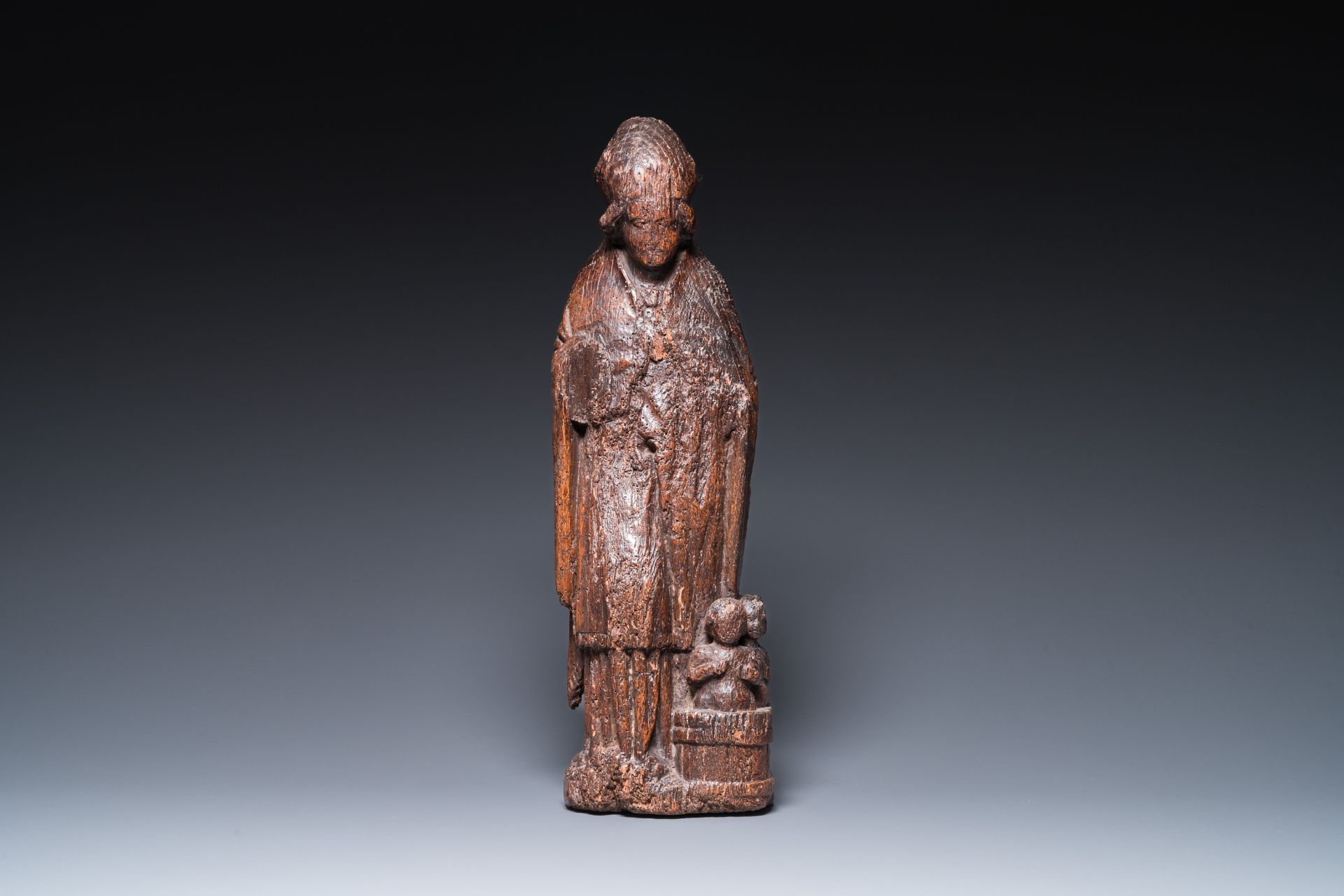 A Flemish carved oak sculpture of Saint Nicolas and the three boys in the salting-tub, 16th C. - Image 2 of 7