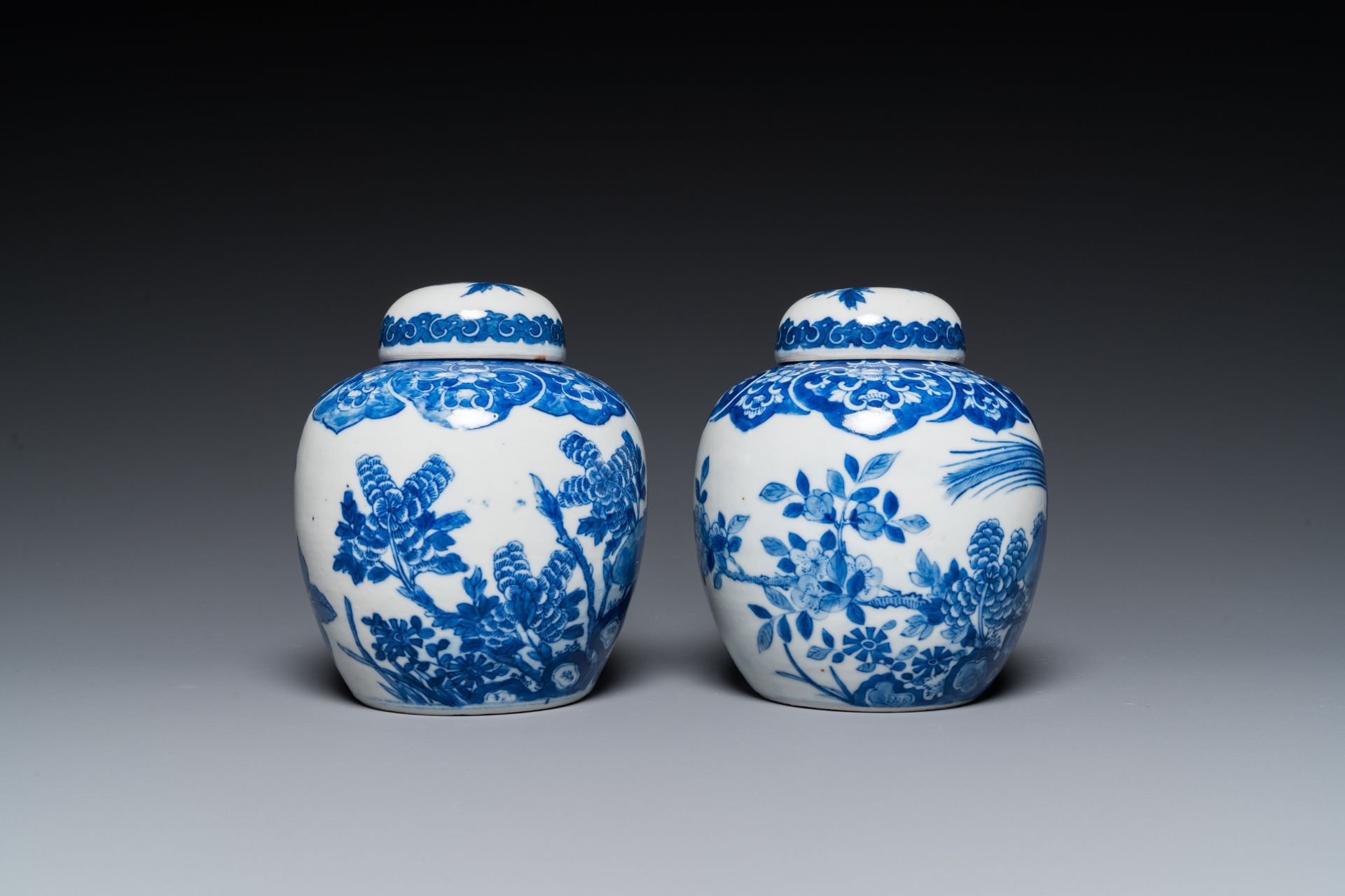 A pair of Chinese Canton famille rose vases and a pair of blue and white covered jars, 19th C. - Image 9 of 13