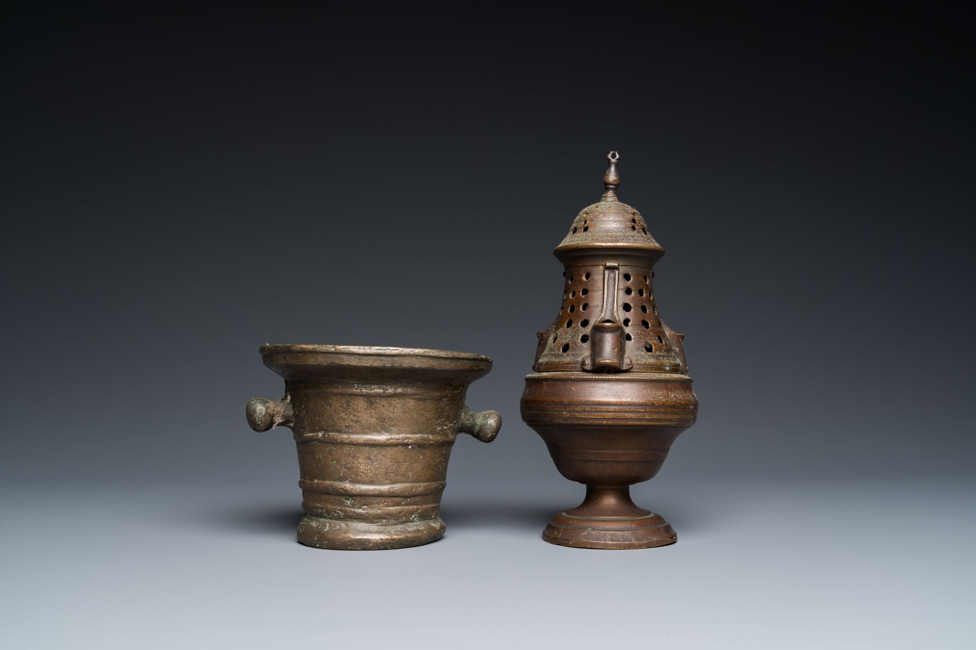 A bronze mortar, a censer and two pax of which one gilded, Western Europe, 16/17th C. - Image 4 of 9