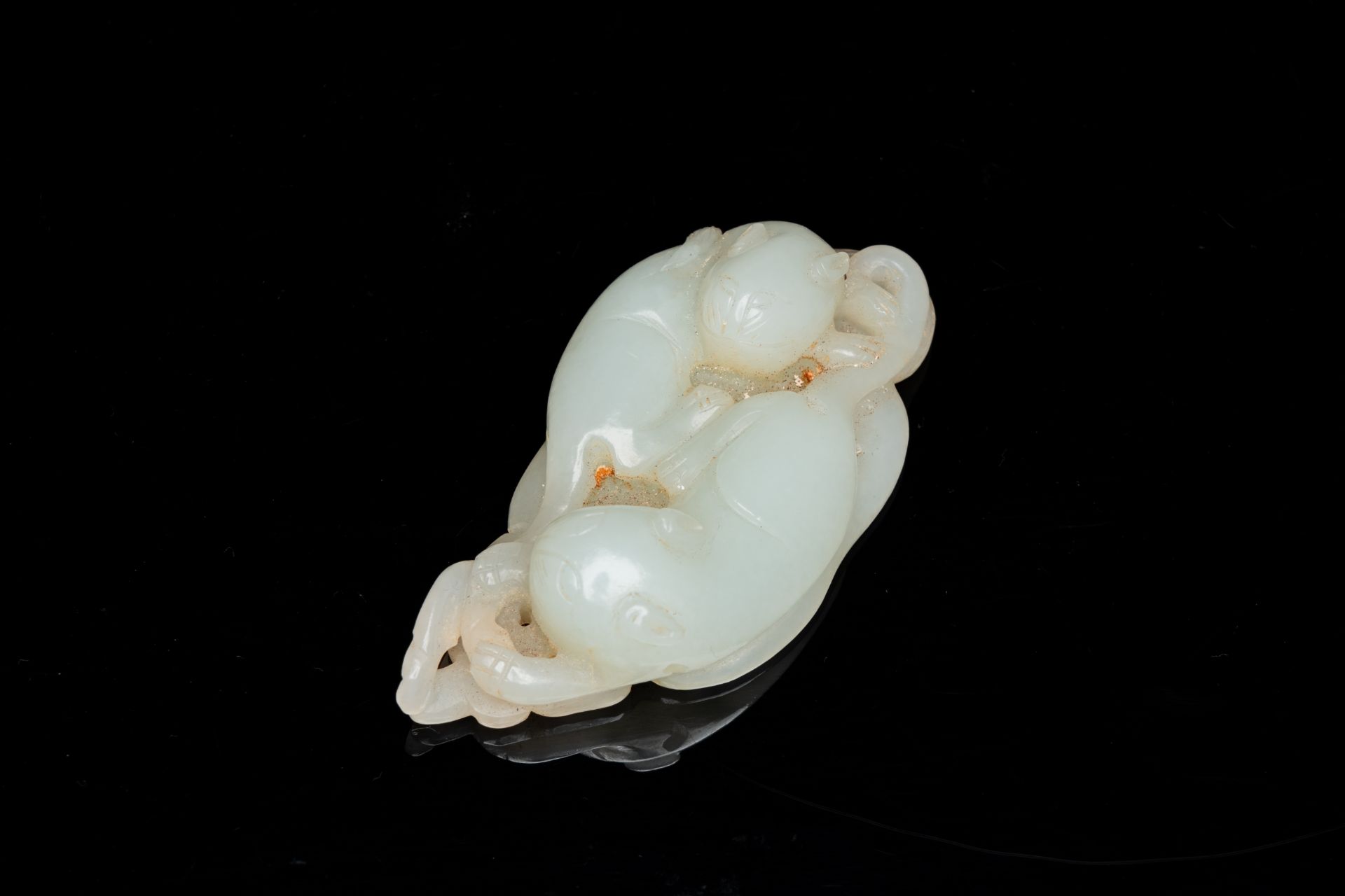 A Chinese 'twin cat' carved jade pendant, Qing