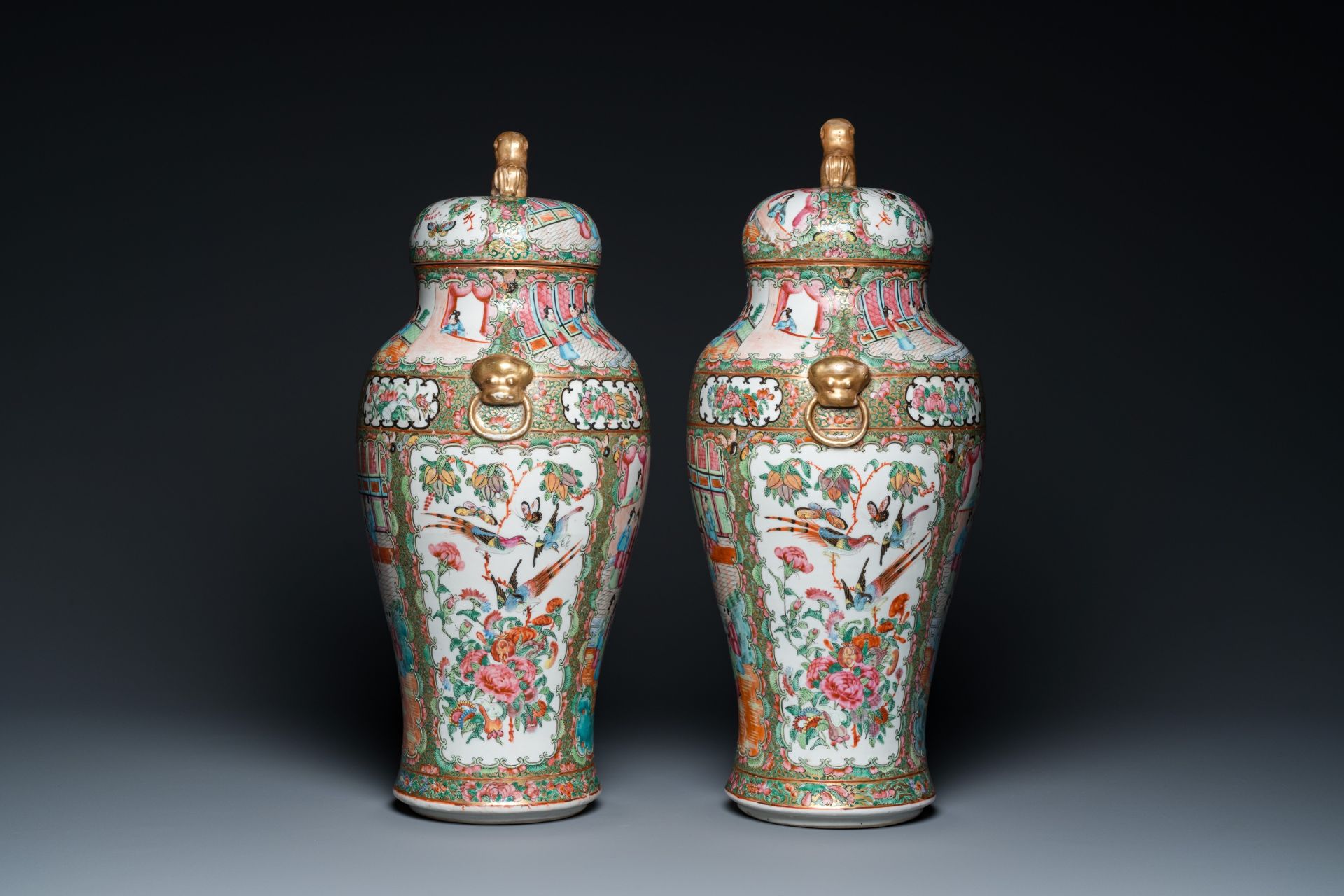A pair of Chinese Canton famille rose vases and covers, 19th C. - Image 4 of 6