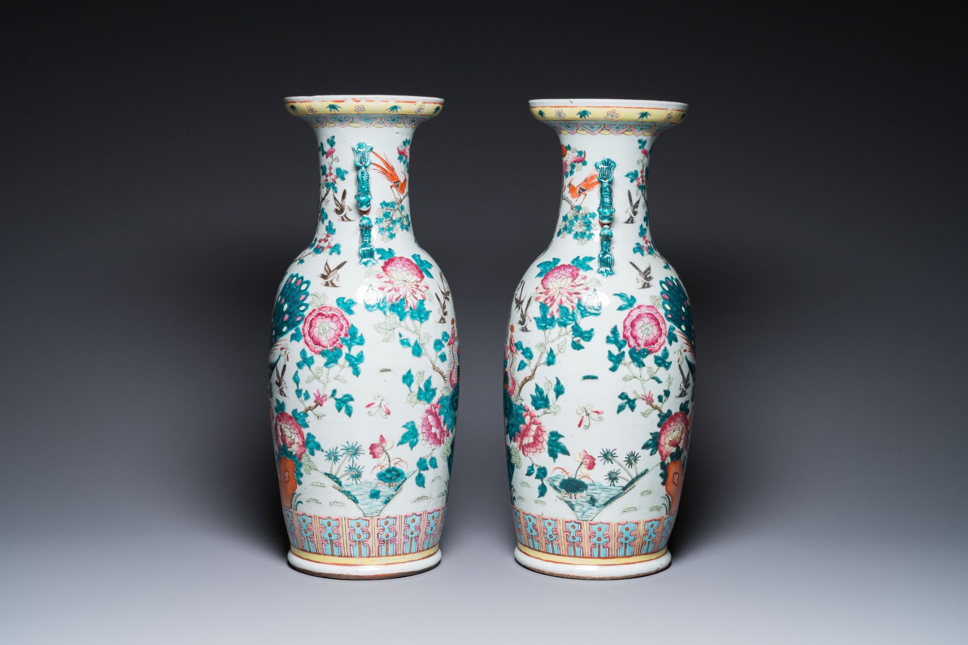 A pair of Chinese famille rose vases with peacocks and phoenixes, 19th C. - Image 4 of 6