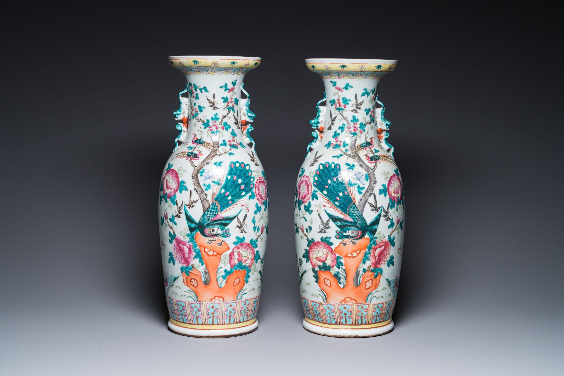 A pair of Chinese famille rose vases with peacocks and phoenixes, 19th C. - Image 3 of 6