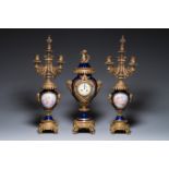A large three-piece Sevres-style clock garniture with gilt bronze mounts, France, 19th C.