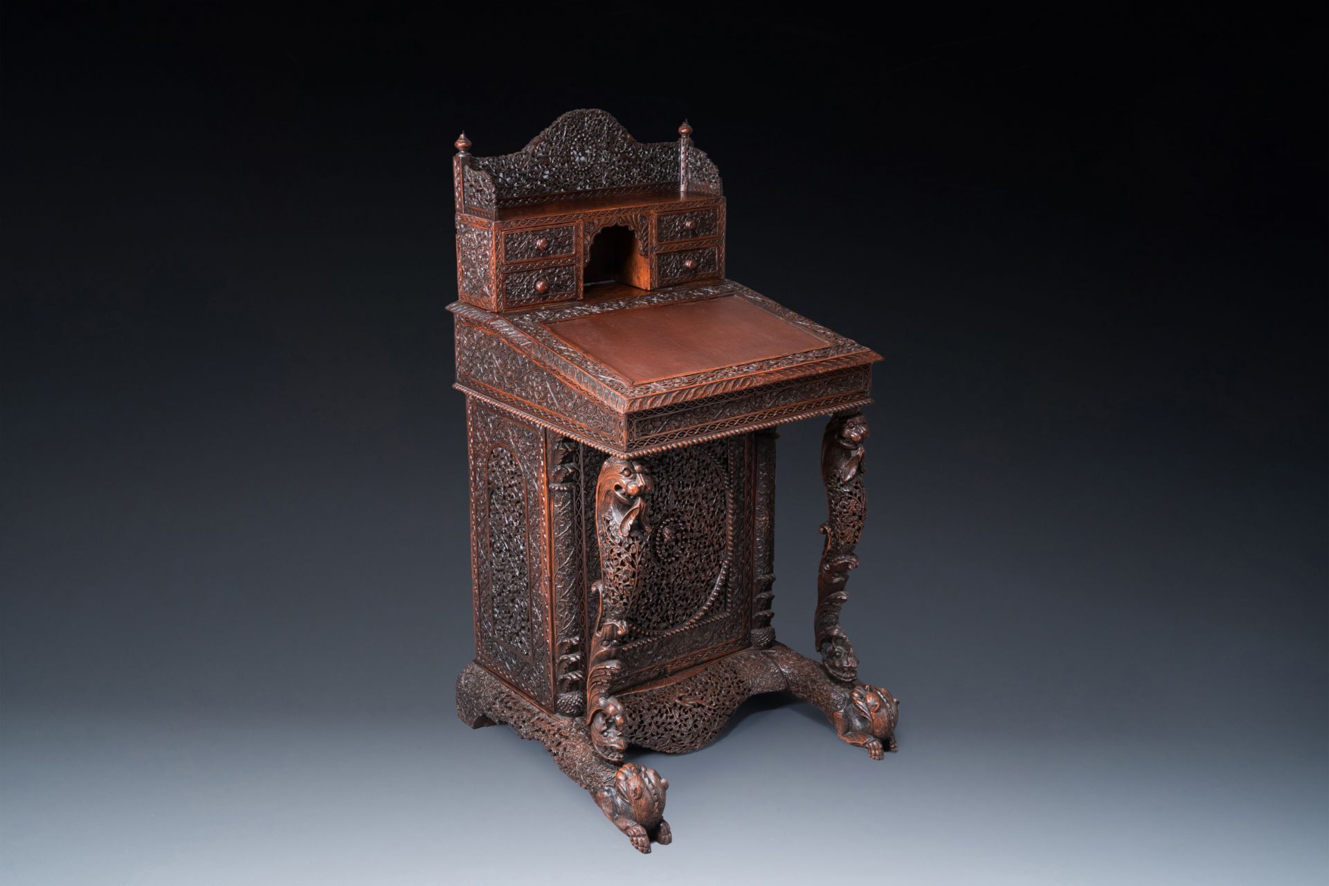 A colonial Anglo-Indian reticulated wooden desk with hidden compartment, 19th C.