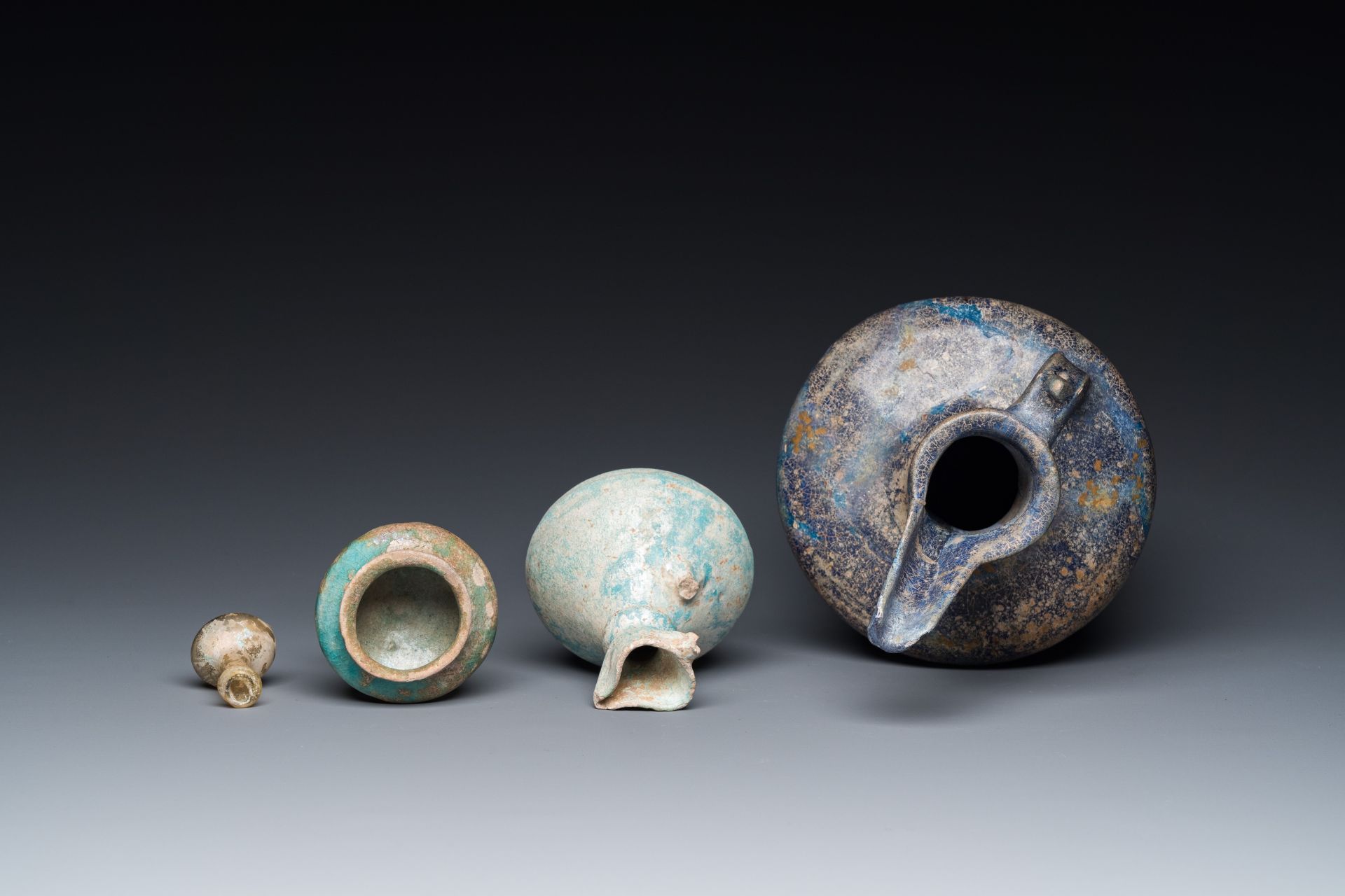 Three blue- and turquoise-glazed Islamic pottery wares and a glass bottle, Kashan and Raqqa, 12th C. - Image 6 of 7