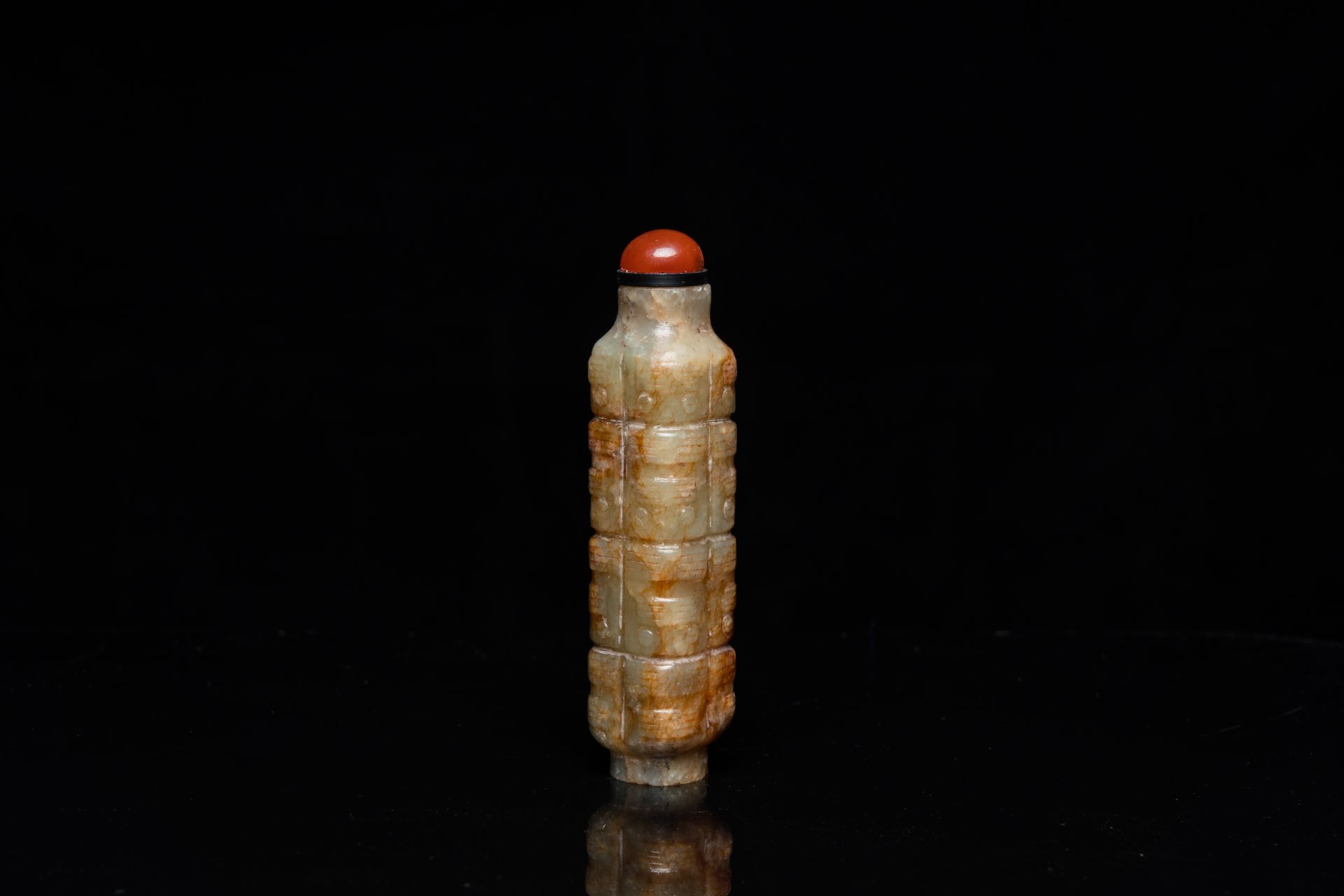 A Chinese celadon and russet jade 'cong' snuff bottle, probably Qing