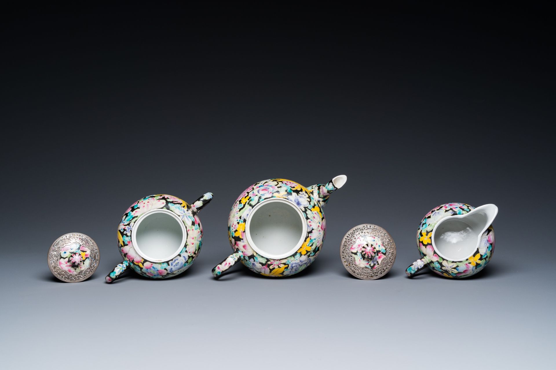 A Chinese eight-piece silver-mounted famille rose millefleurs tea service, Qianlong mark 20th C. - Image 9 of 12