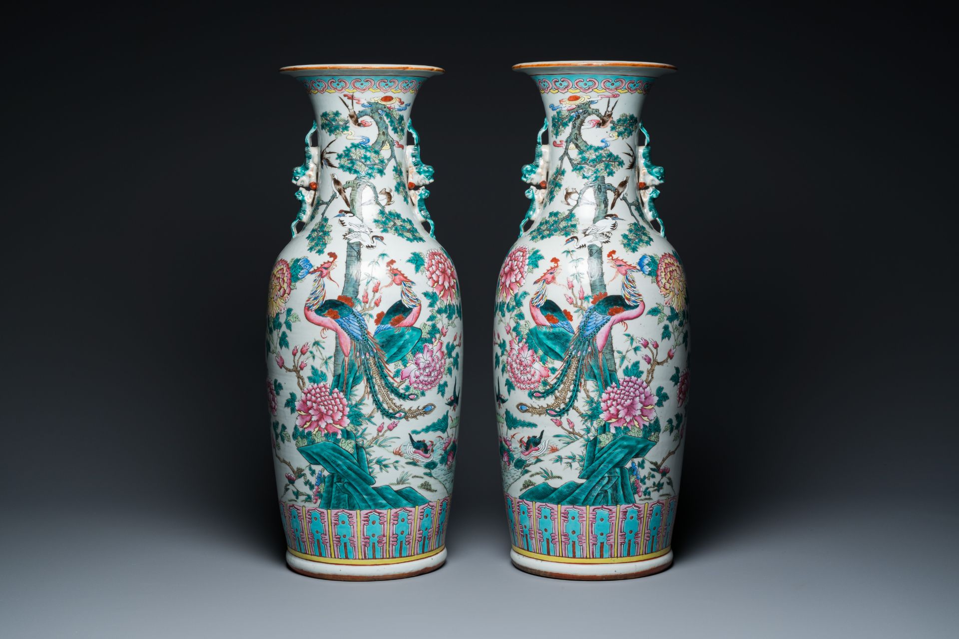 A pair of Chinese famille rose 'phoenixes and pheasants' vases, 19th C.