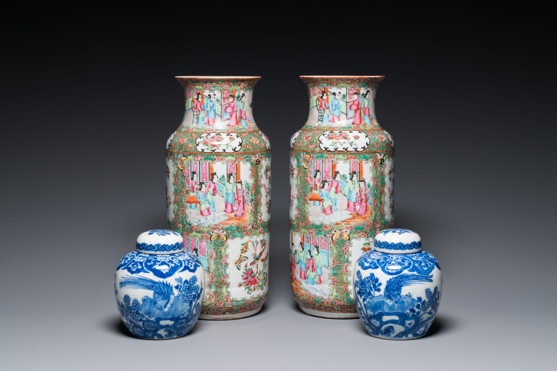 A pair of Chinese Canton famille rose vases and a pair of blue and white covered jars, 19th C.