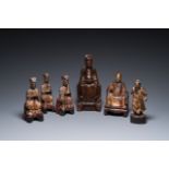 Six Chinese partly gilded wooden sculptures of dignitaries and guards, Ming and later