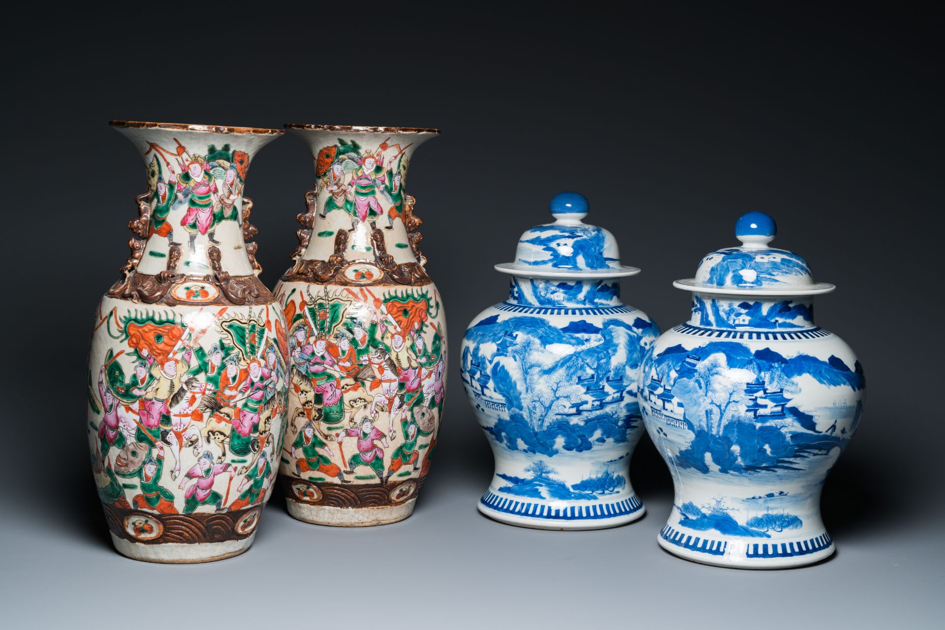 A pair of Chinese blue and white covered vases and a pair of Nanking famille rose vases, 19th C.