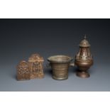 A bronze mortar, a censer and two pax of which one gilded, Western Europe, 16/17th C.