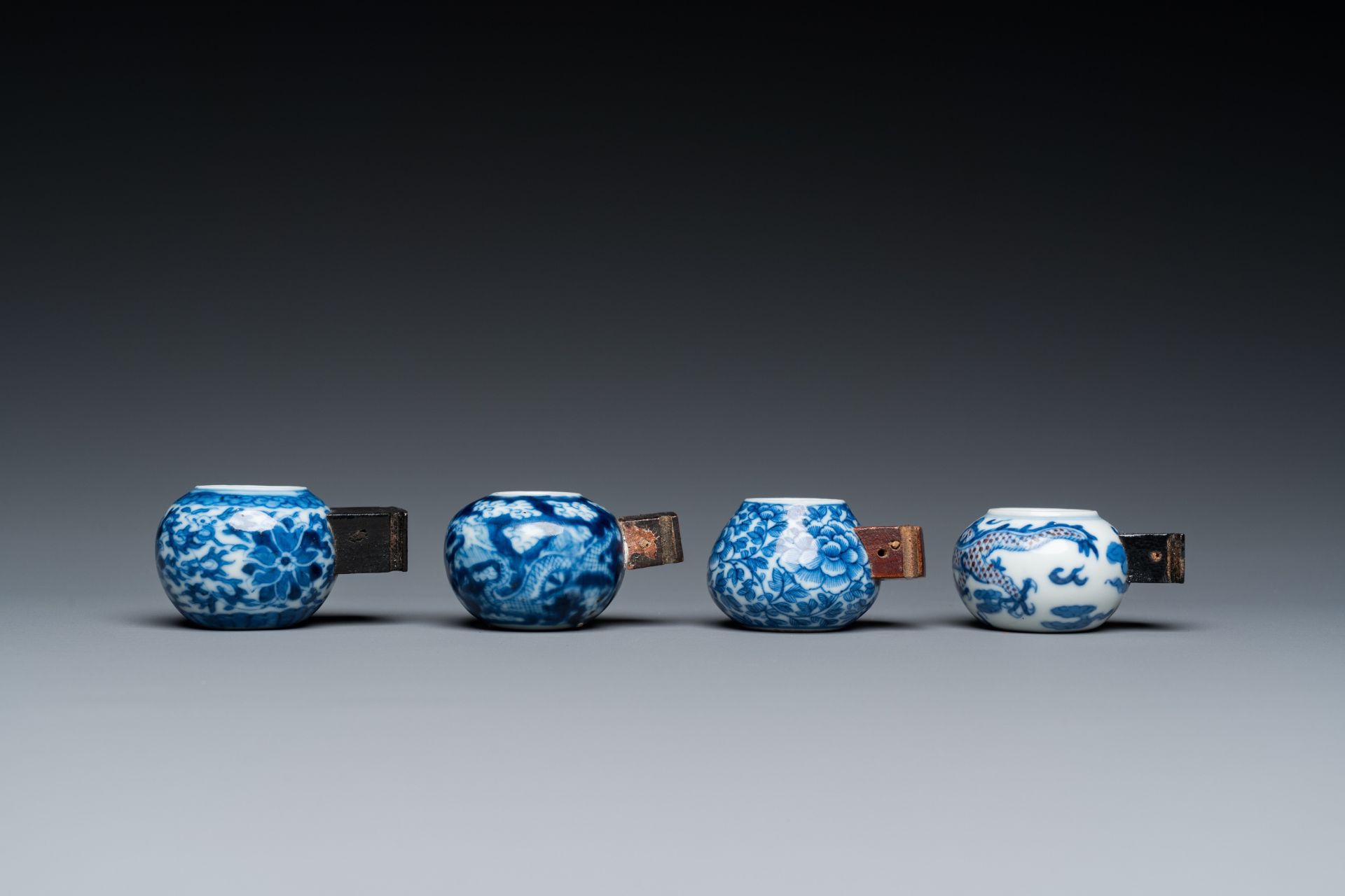 Four Chinese blue, white and copper-red bird feeders, 19th C. - Image 4 of 7