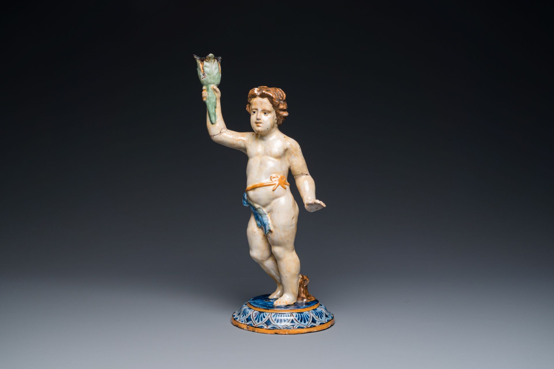 A polychrome pottery sculpture of a standing young man, Spain or France, 18/19th C.