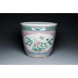A Chinese pink-ground famille rose jardiniere, 19th C.