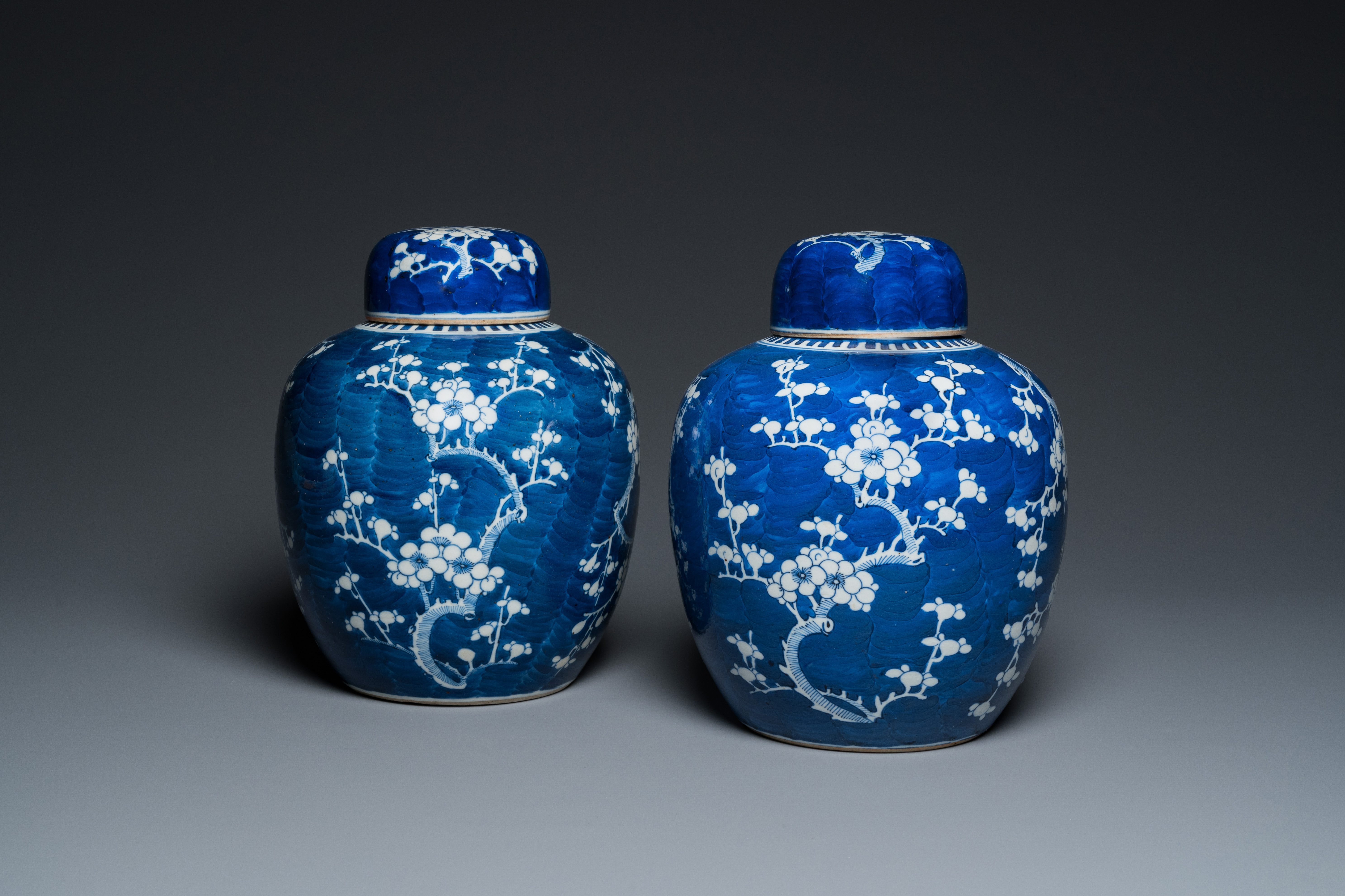 A pair of Chinese blue and white jars and covers, 19th C.