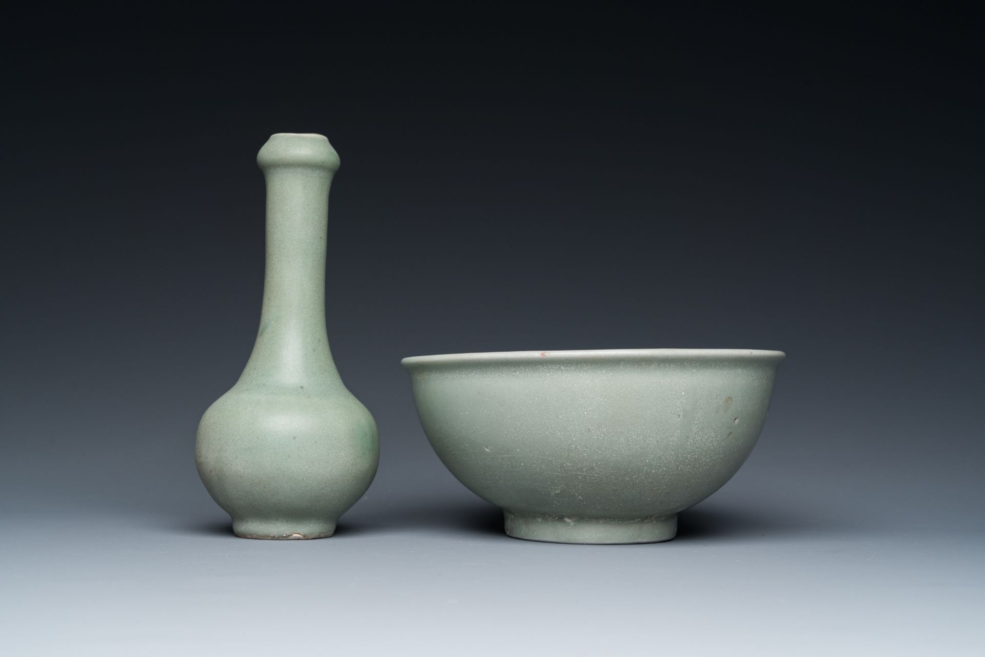 A Chinese celadon-glazed bottle vase and two bowls, Yuan/Ming - Image 5 of 9