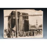 A black and white photo of the Kaaba at Mecca, dated 1914