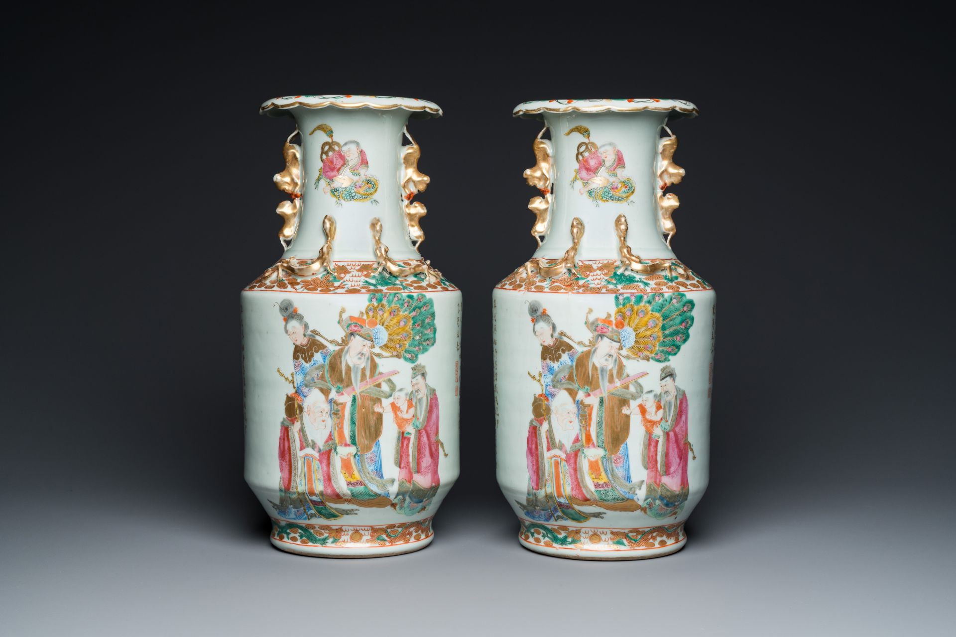 A pair of Chinese Canton famille rose 'immortals' vases, 19th C.