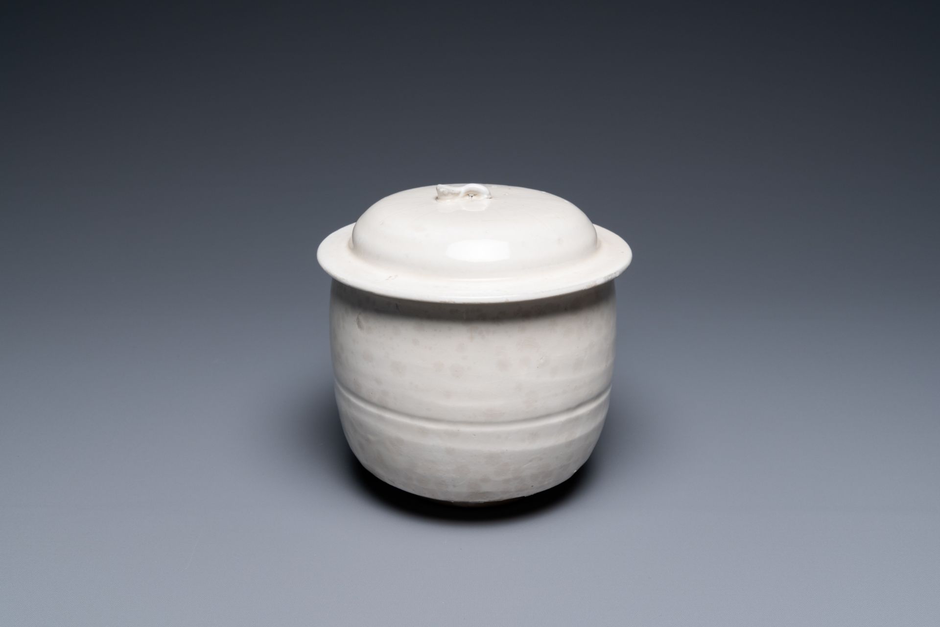 A Chinese cream-glazed jar and cover, Northern Song