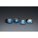 Four Chinese blue, white and copper-red bird feeders, 19th C.