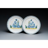 A pair of polychrome Dutch Delft plates depicting grinders, 18th C.