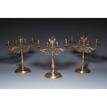 Three large Polish or Prussian bronze 'shabbat' candlesticks crowned with double eagles, 17th C.