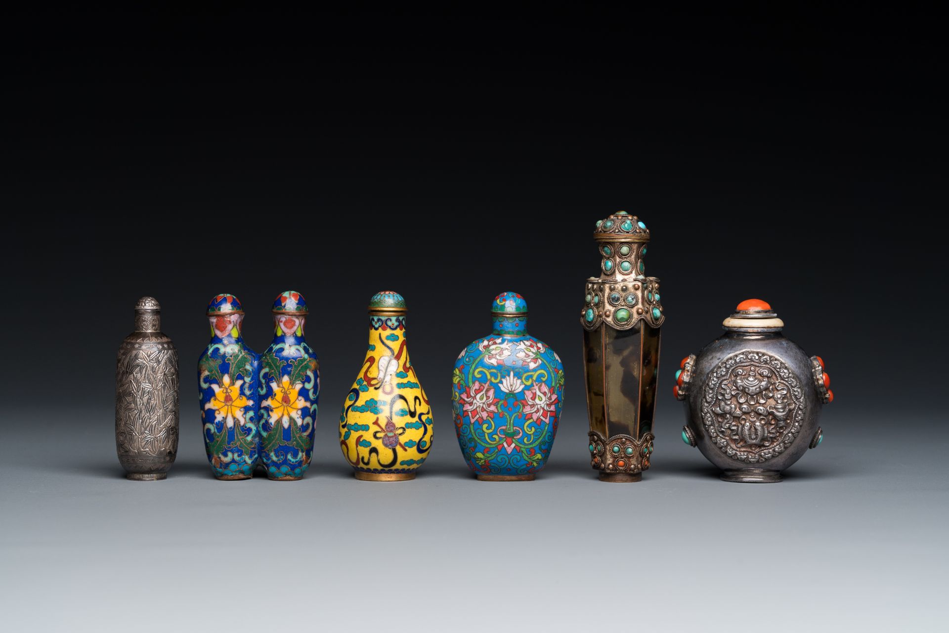 Six Chinese silver and cloisonne snuff bottles, 19/20th C.