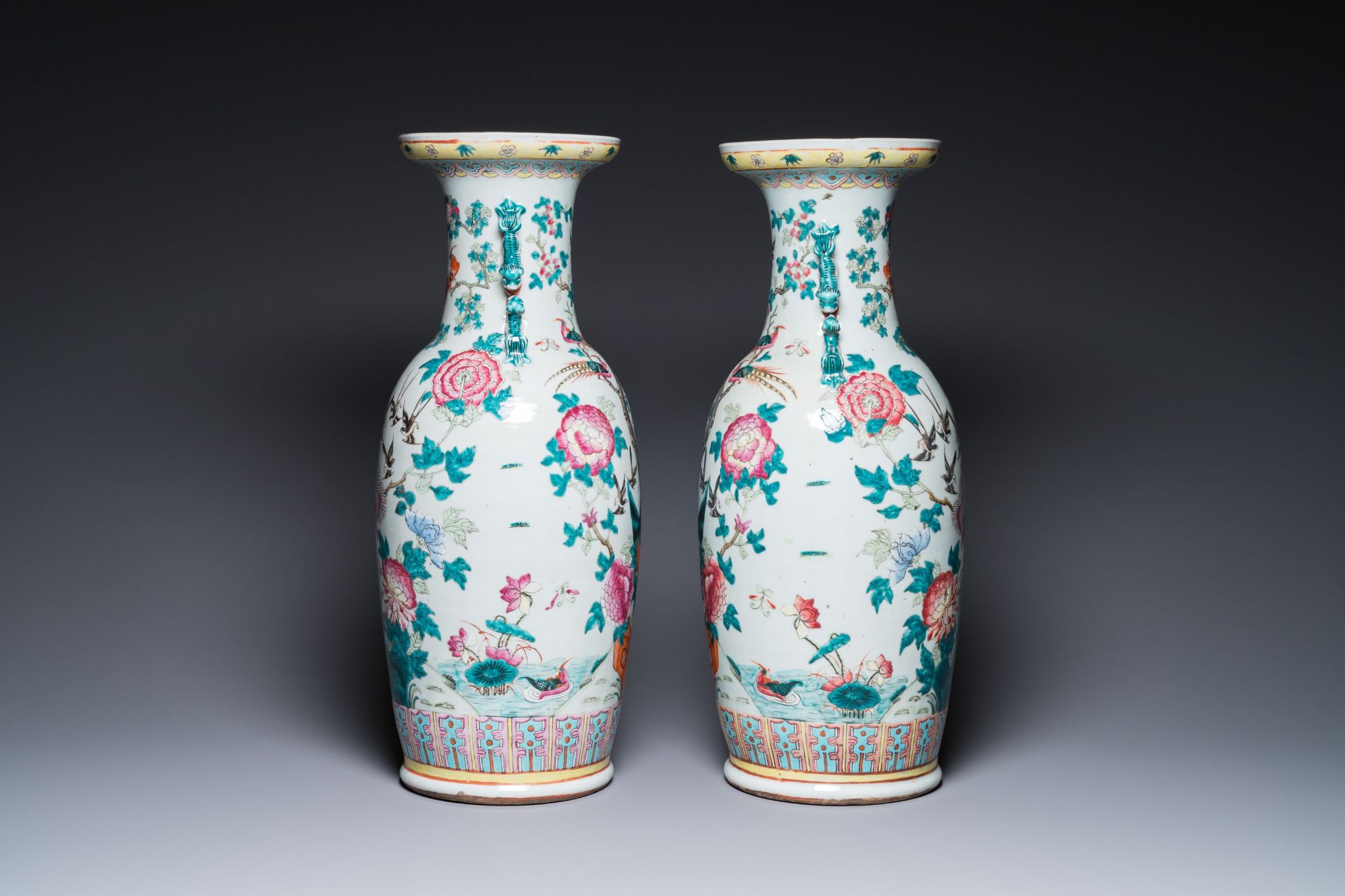 A pair of Chinese famille rose vases with peacocks and phoenixes, 19th C. - Image 2 of 6